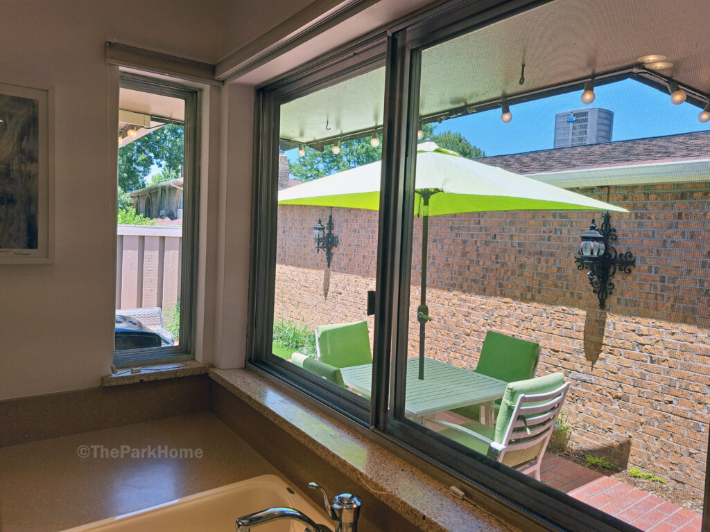 The window over the kitchen sink looks out onto your private patio.